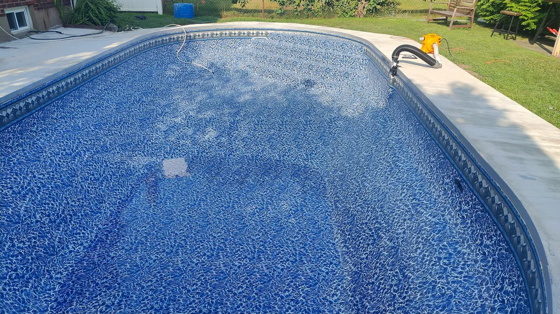 Inground pool with newly installed blue vinyl liner
